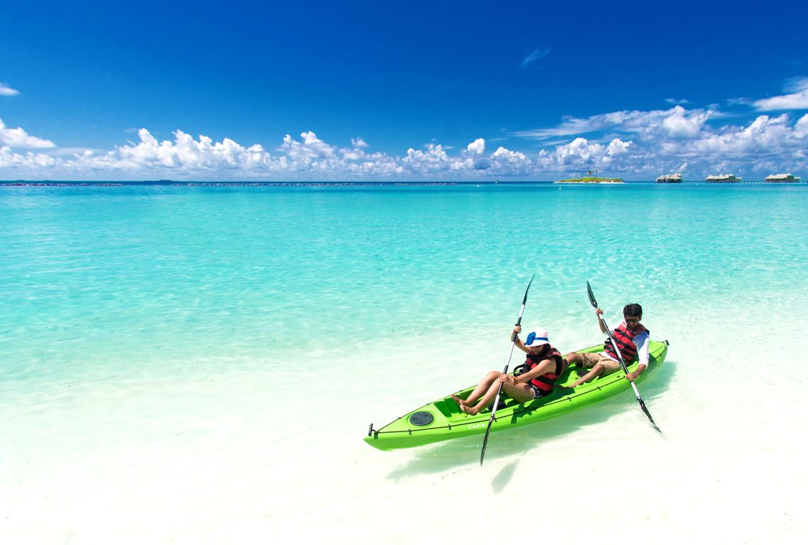 Turquoise Caribbean waters surrounding a small island in the Rosario Islands archipelago